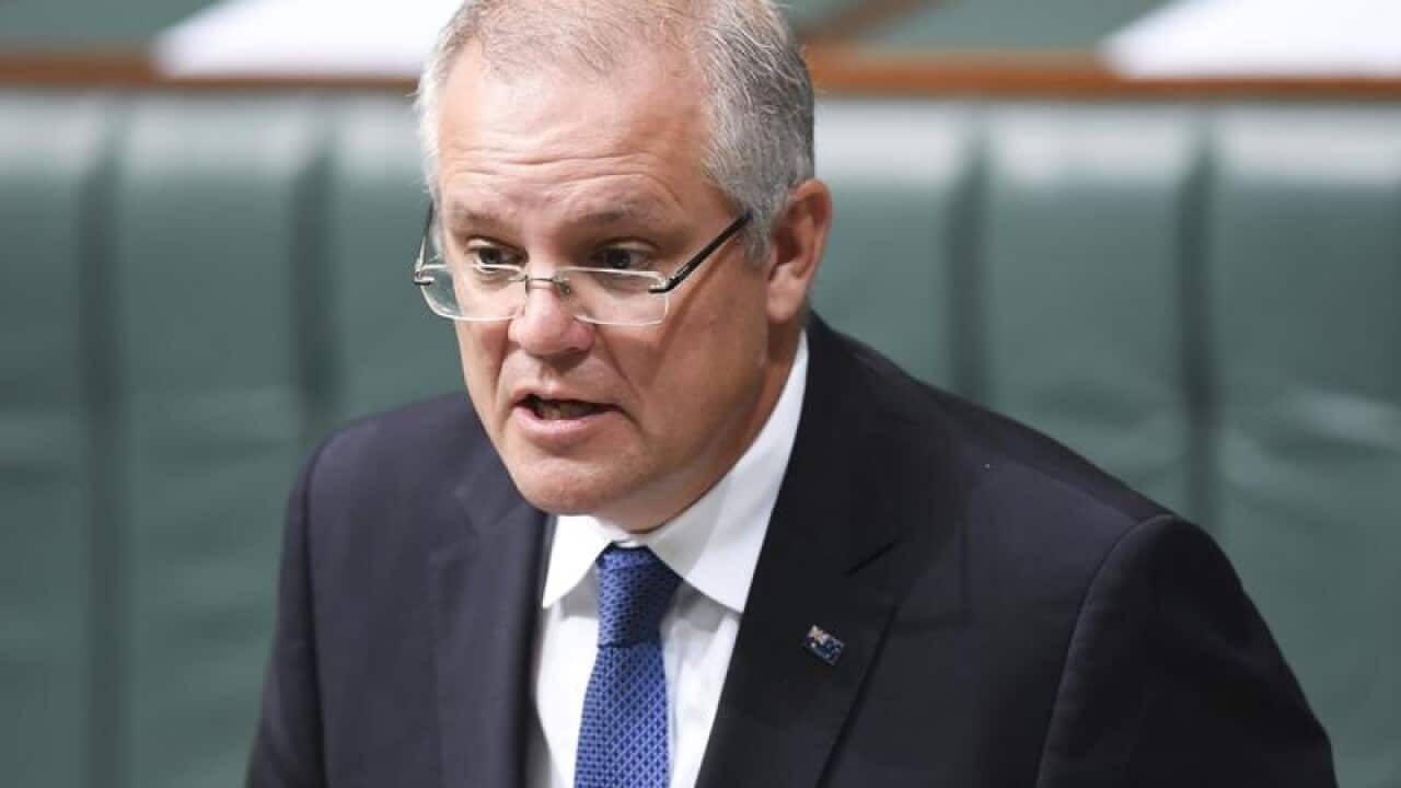 Treasurer Scott Morrison makes a statement at Parliament House.