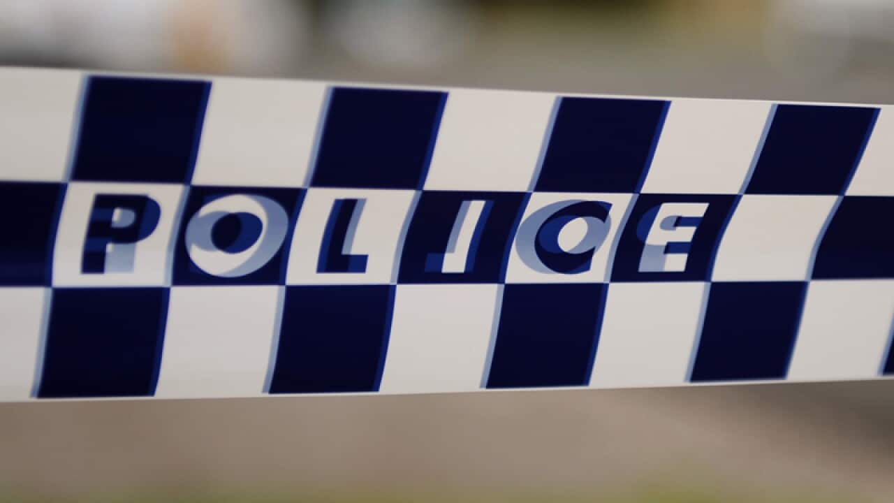 Police tape restricts access