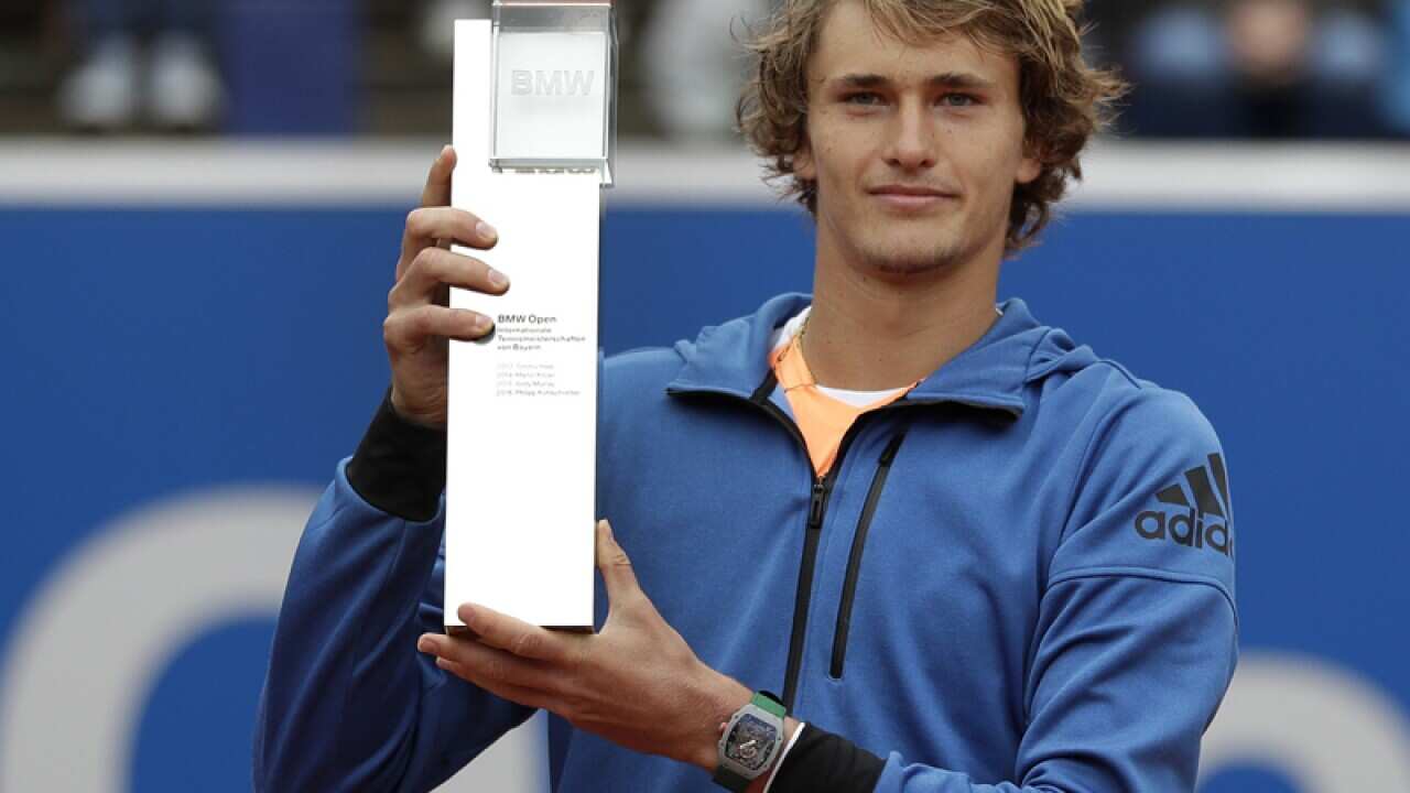 Alexander Zverev of Germany lifts up the trophy
