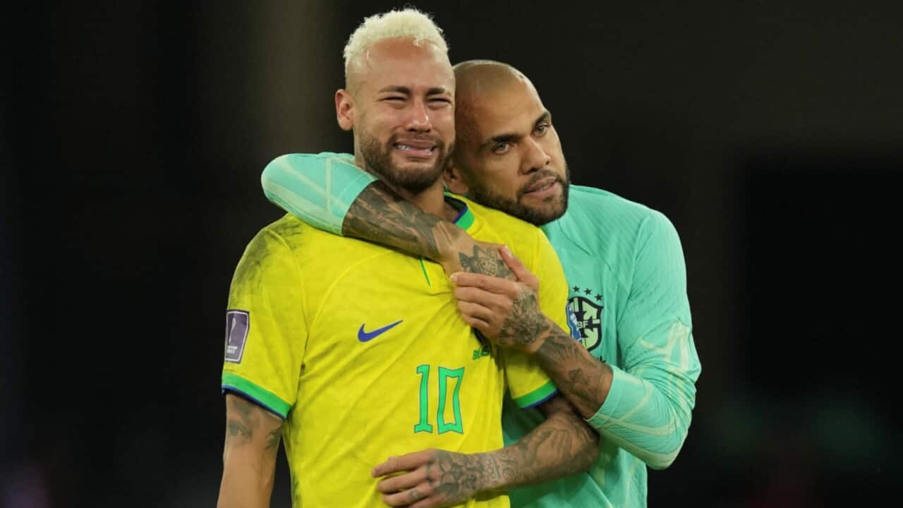 Dani Alves consoles a tearful Neymar after Brazil's World Cup elimination