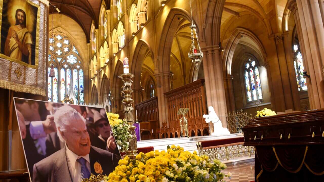 The casket of horse trainer Bart Cummings lies at St Mary's Cathedral