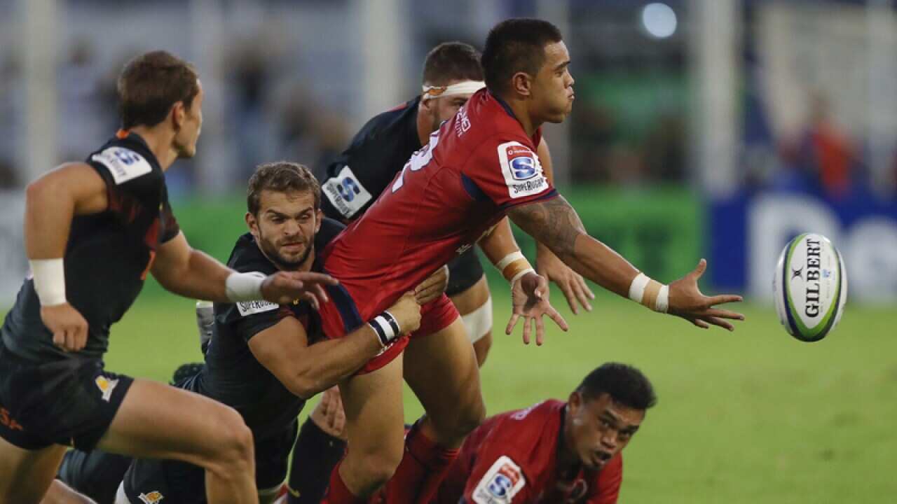 Duncan Paiaiaua (2-R) of the Queensland Reds in action