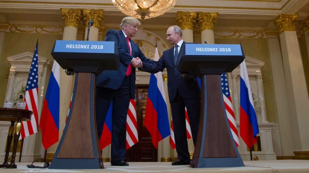 U.S. President Donald Trump and Russian President Vladimir Putin shake hands during a join press conference at the Presidential Palace in Helsinki, Finland, Monday, July 16, 2018. (AP Photo/Pablo Martinez Monsivais)
