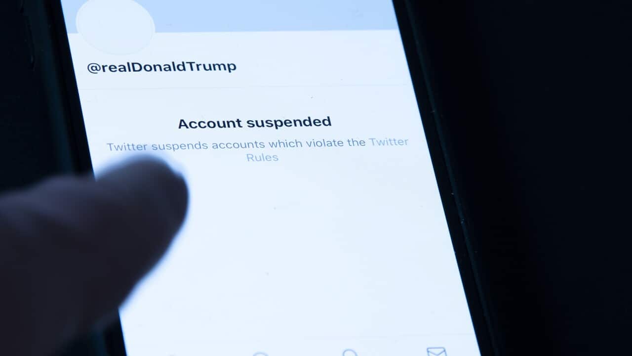 President Donald Trump's suspended Twitter account is seen on a mobile phone