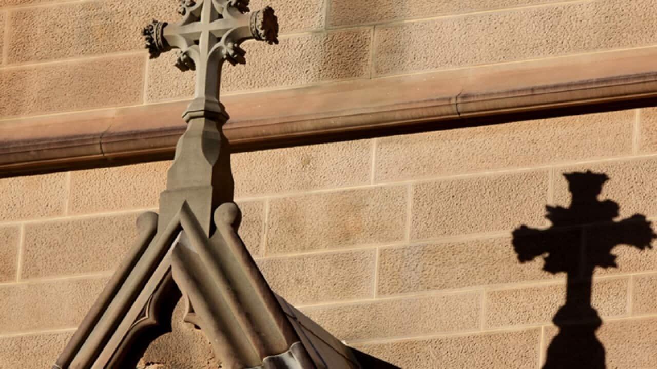 A cross on the exterior of a cathedral in Sydney