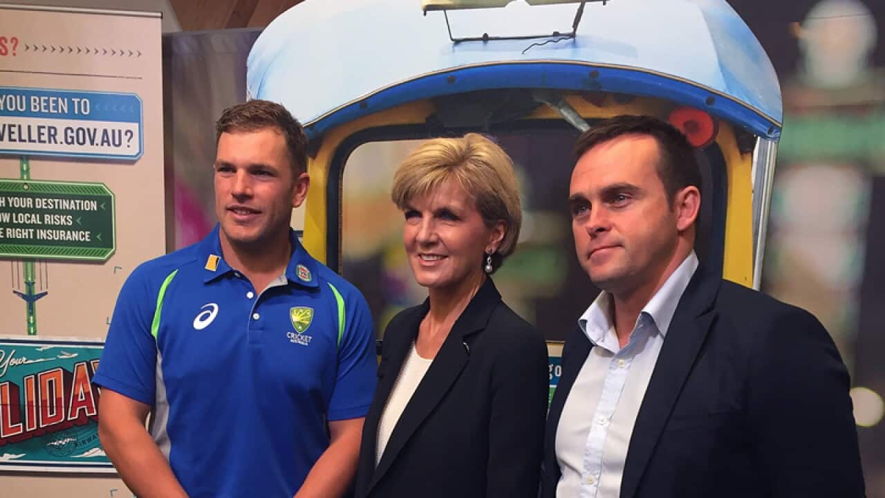 Julie Bishop centre, poses for a photograph with actor Les Hill, right