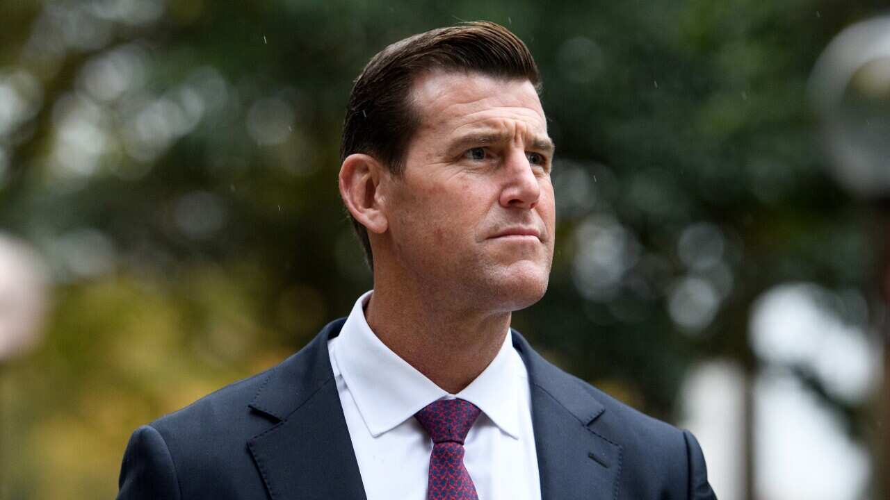 Man in suit in light rain.