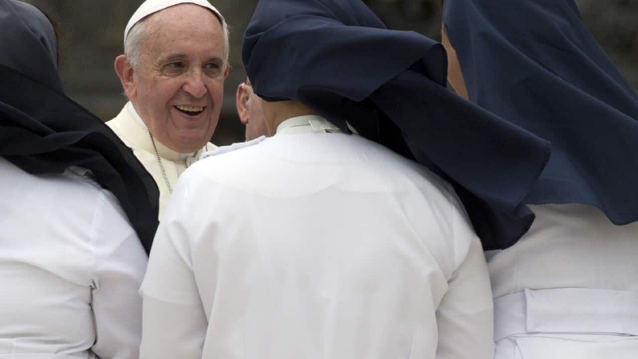 Pope Francis greets nuns in St. Peter's Square