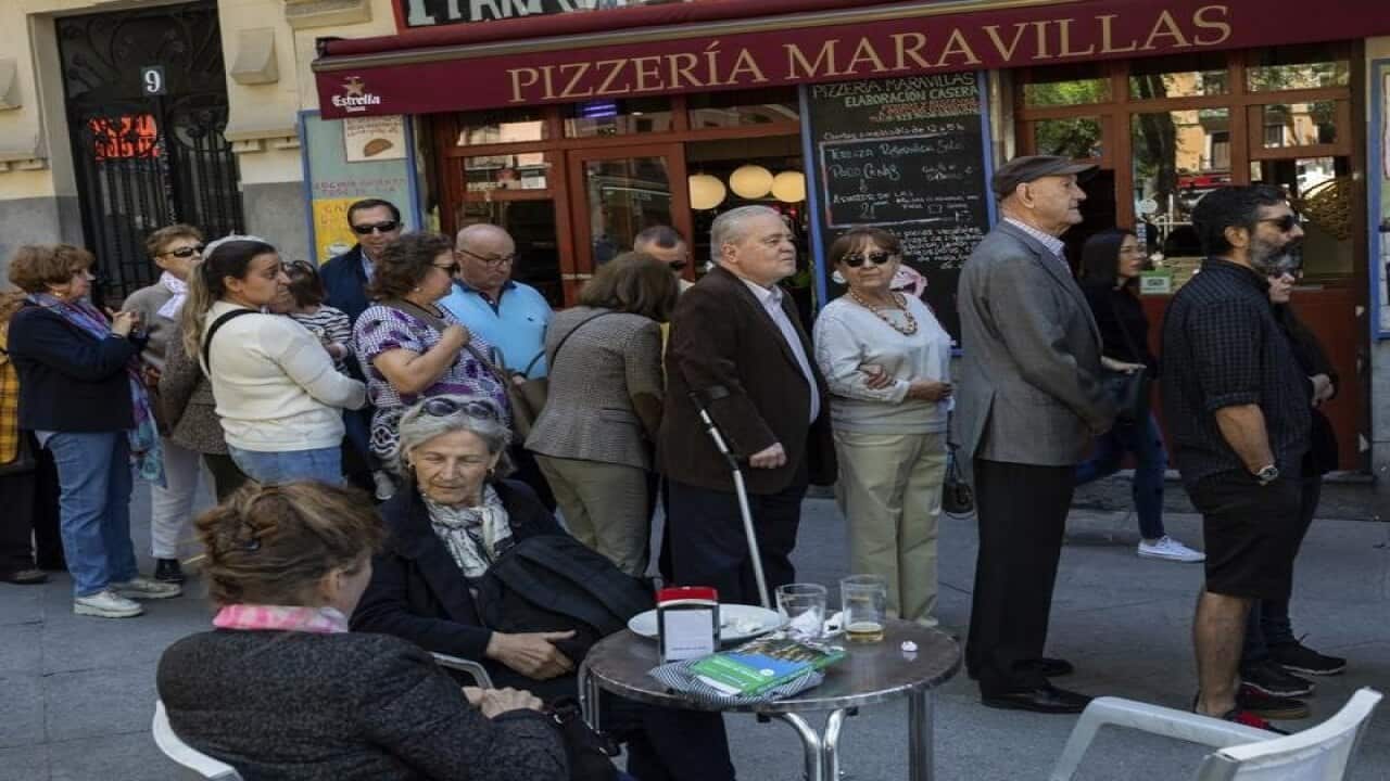 People line up to vote in Spain's general election