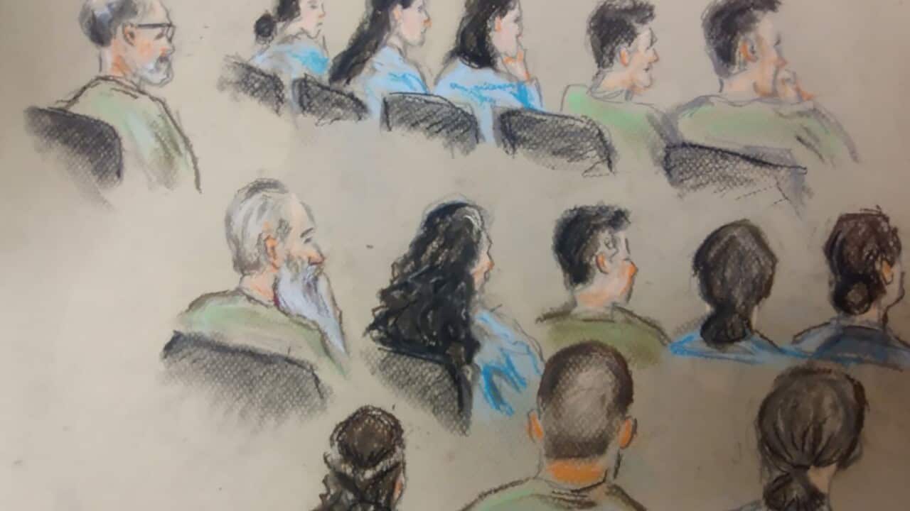 A sketch of 14 people in a courtroom.
