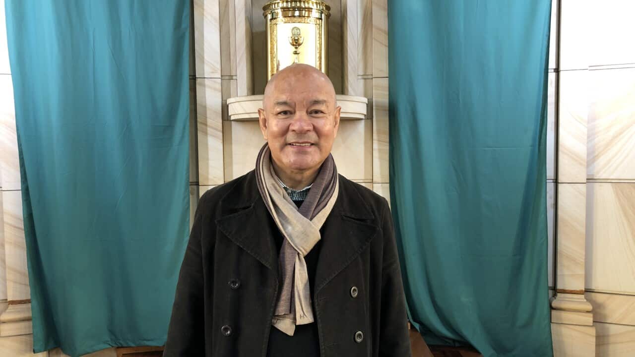 Deacon Roberto Corpuz preparing for Sunday Mass at Our Lady of Dolours Catholic Church in Sydney.