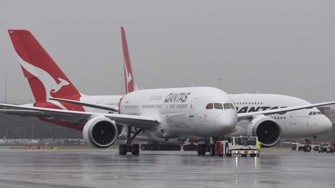 The new QANTAS Boeing 787 Dreamliner aircraft is followed by an A380 Airbus as it arrives on its first flight into Sydney, Friday, October, 20, 2017.  (AAP Image/Dean Lewins) NO ARCHIVING