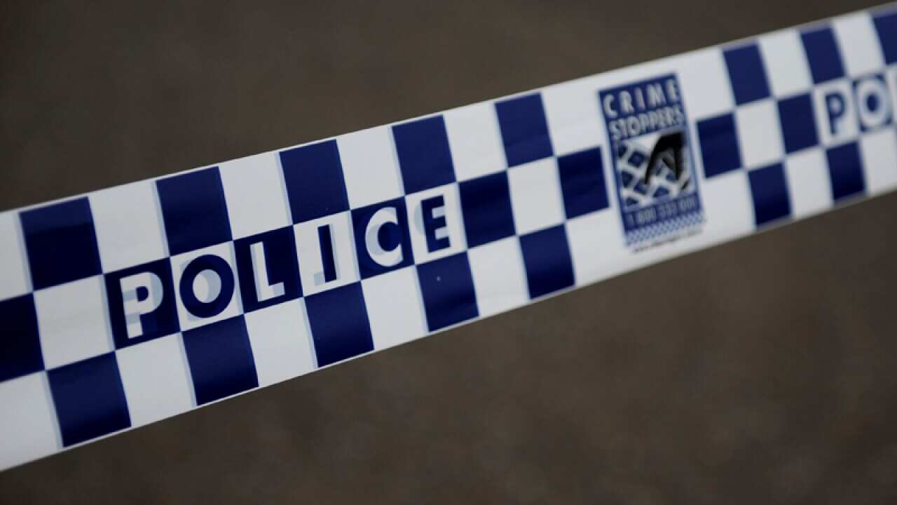 Police tape cordons off a scene.