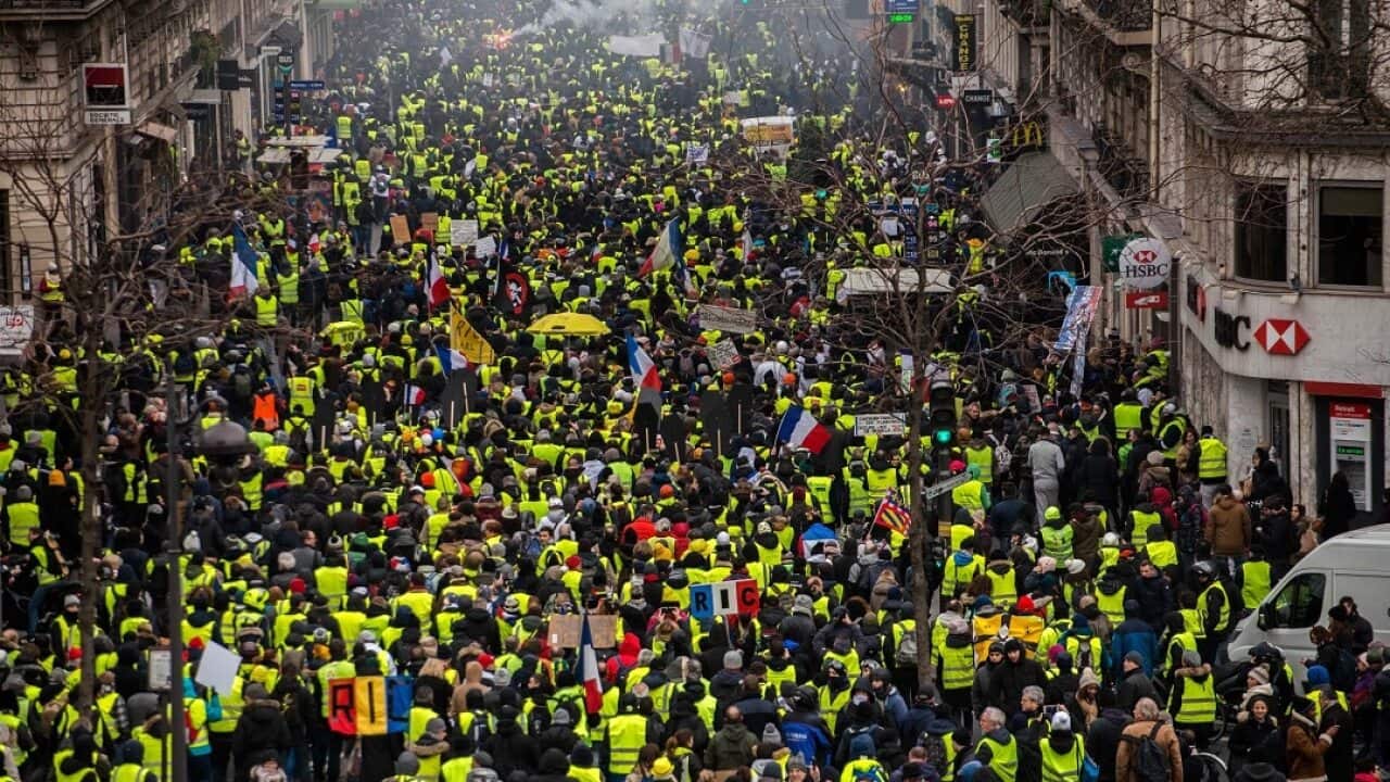 Thousands march in France despite Macron's attempts to channel their anger into a series of public debates.