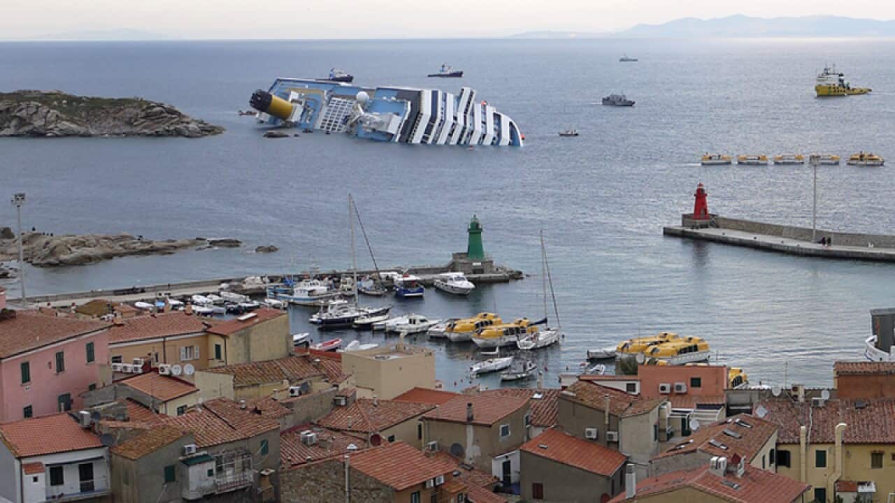 January 13: Cruise liner Costa Concordia grounded in front of the harbour of Isola del Giglio after hitting underwater rocks. Of the 3,229 passengers, 30 bodies have been located, and two more are presumed dead (AP)