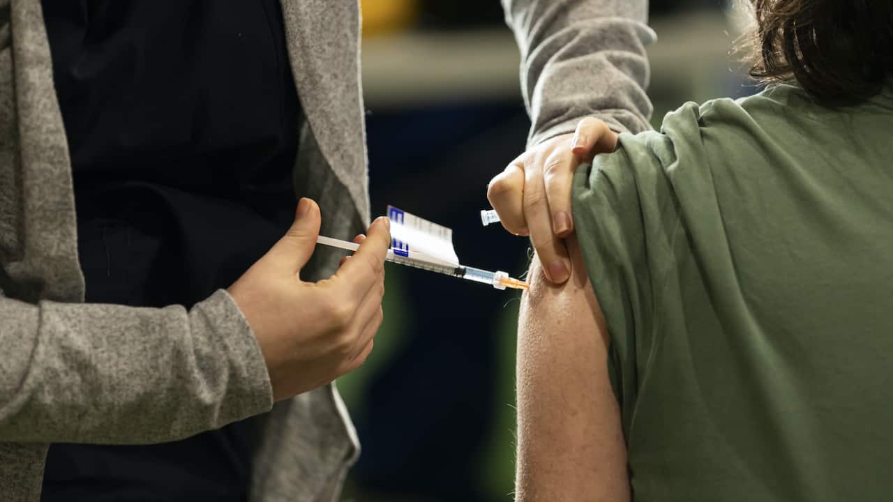 A person receives a vaccination at a pop-up vaccination clinic at Casey Fields in Melbourne