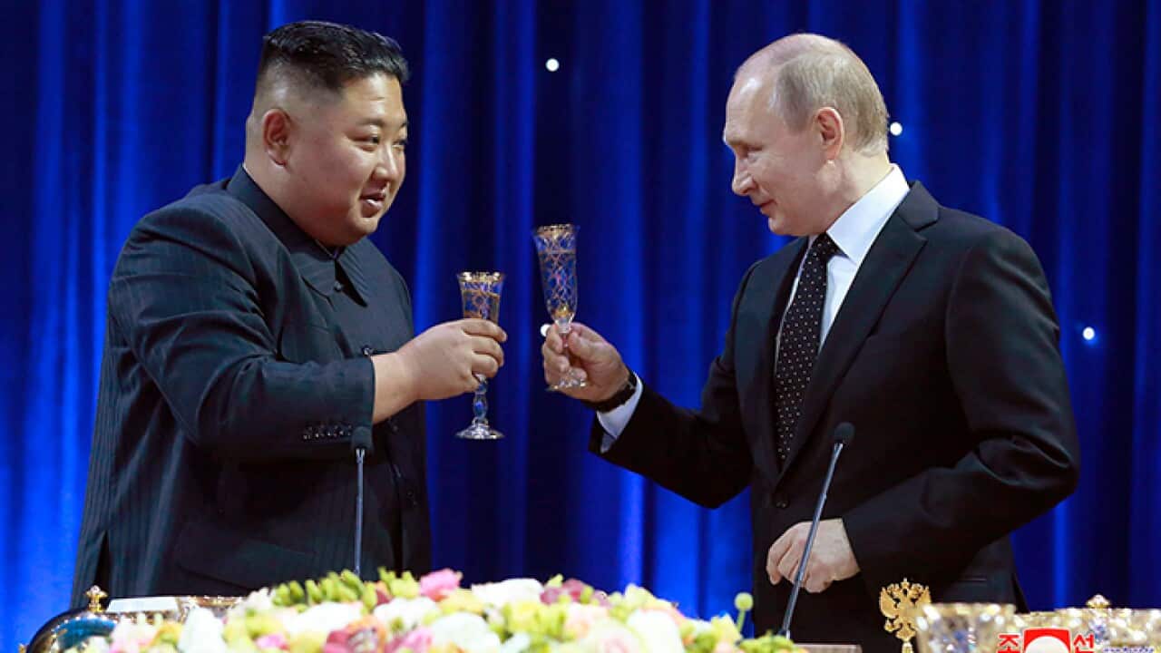 North Korean leader Kim Jong Un, left, toasts with Russian President Vladimir Putin in Vladivostok, Russia.