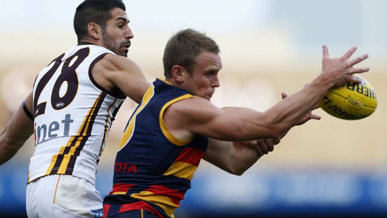 Brent Reilly (right) of the Crows