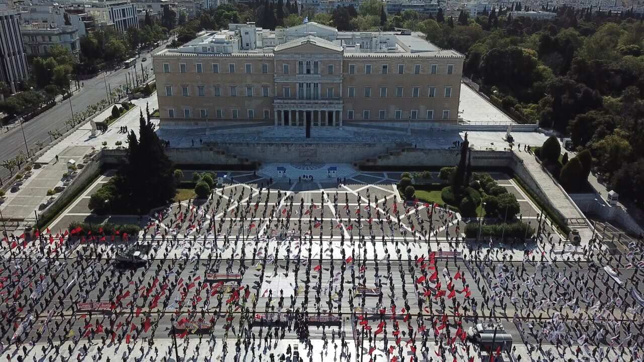 Protesters practice social distancing during a May Day rally outside the Greek Parliament, in Athens.