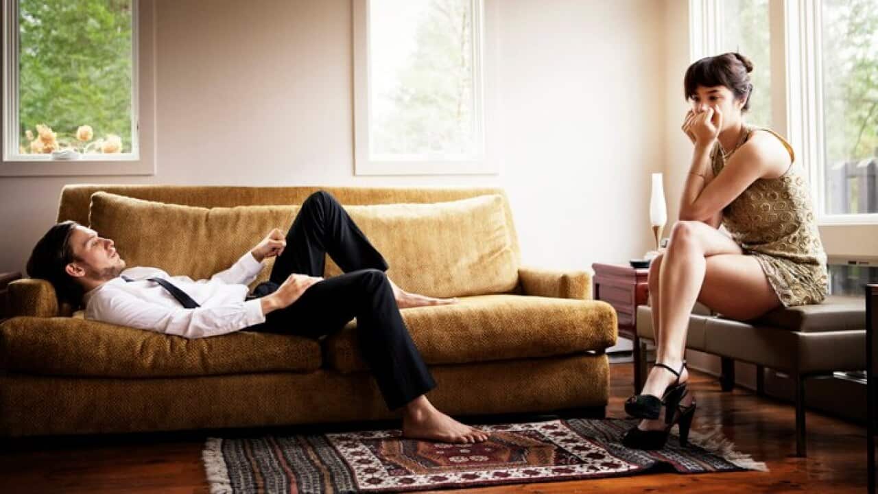 Unhappy couple in living room