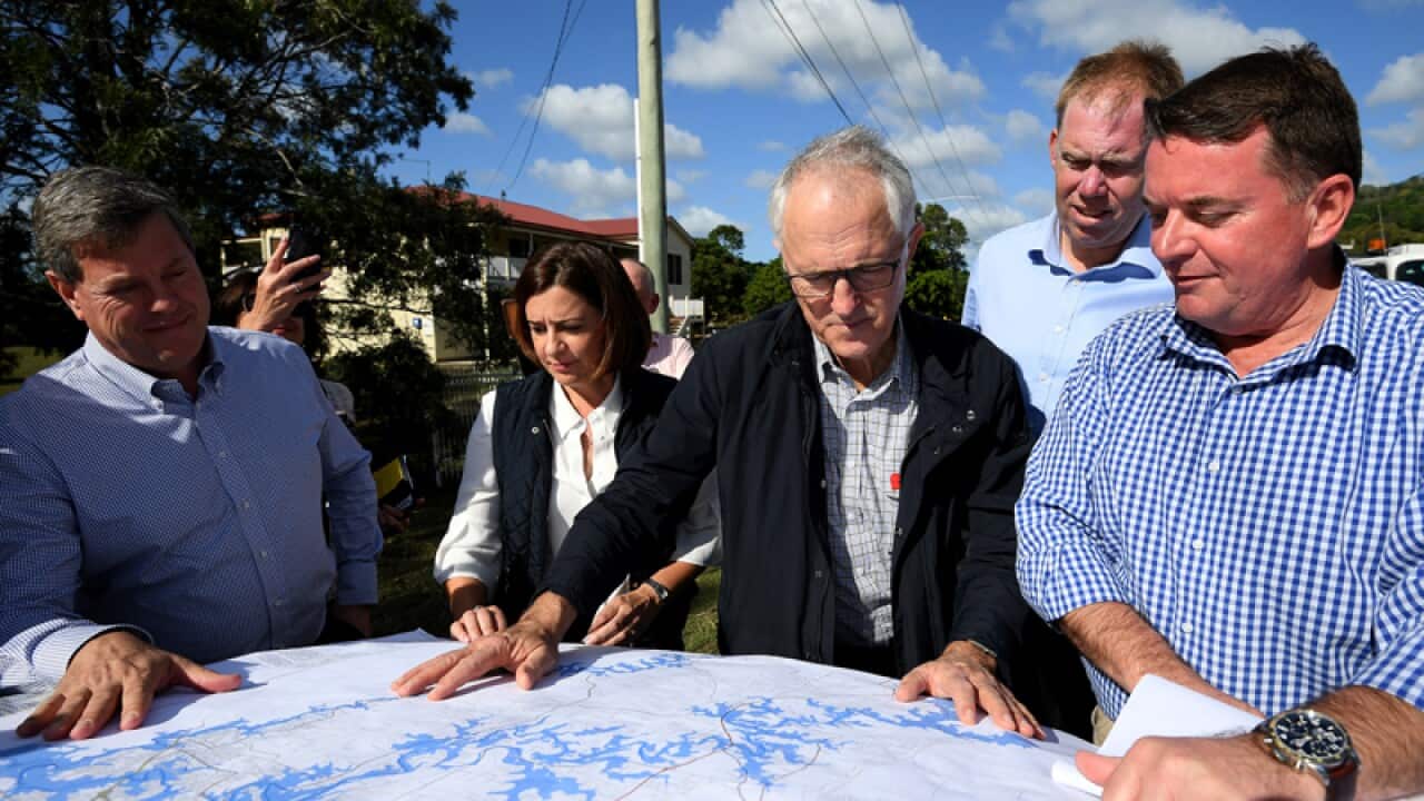 Malcolm Turnbull is shown flood maps in Eagleby