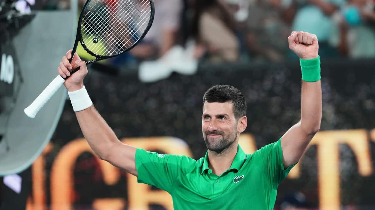 Novak Djokovic of Serbia celebrates after defeating Pedro Martinez of Spain in their first round match at the Australian Open tennis championship in Melbourne