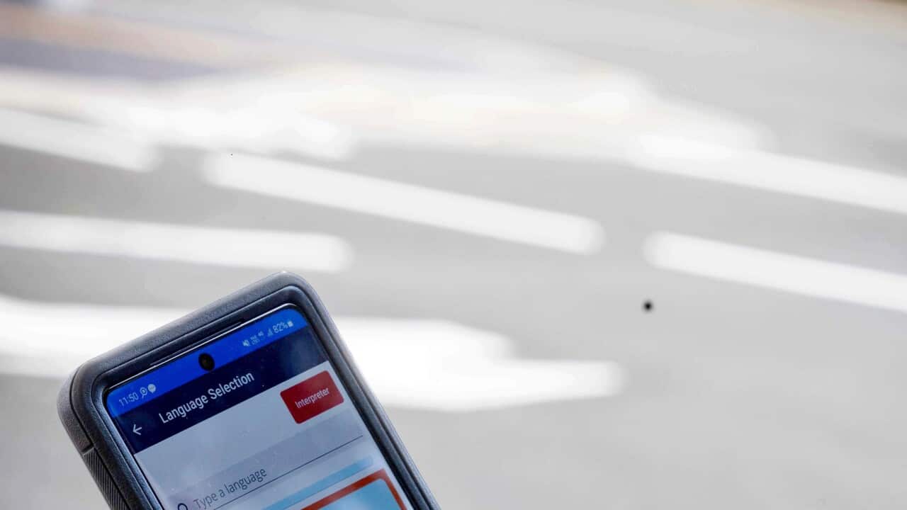 A police officer uses the Language Plus app (image supplied NSW Police).jpg