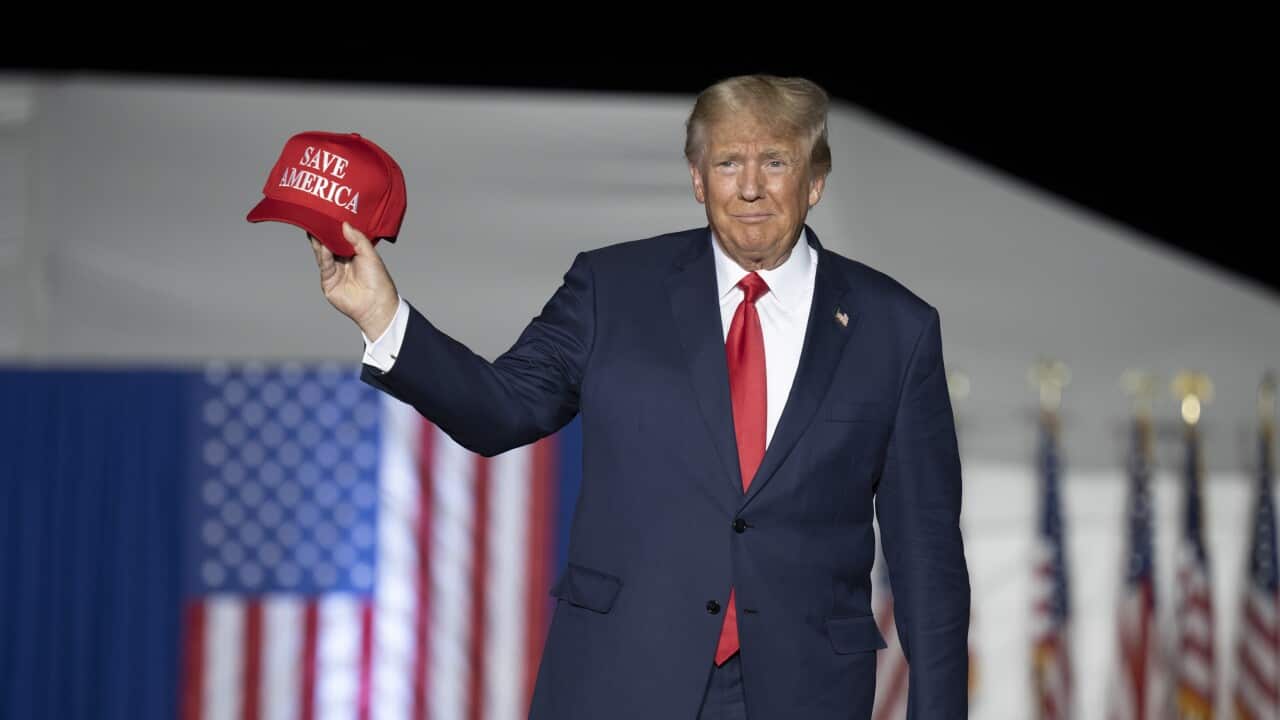 Former President Donald Trump makes his entrance at a rally