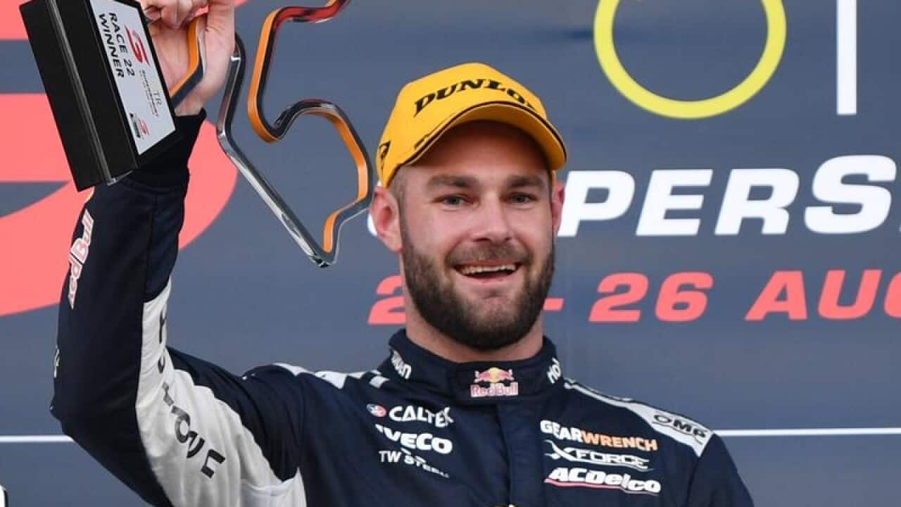 File image of Shane van Gisbergen holding up a trophy.