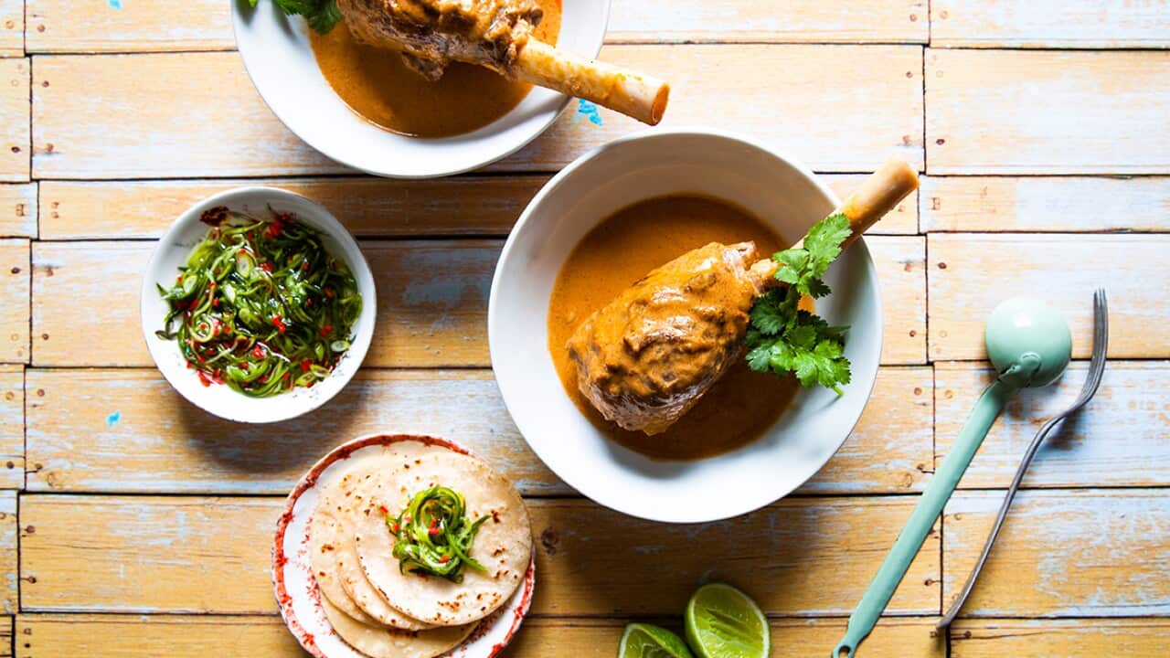 Massaman lamb shanks with pancakes and cucumber relish