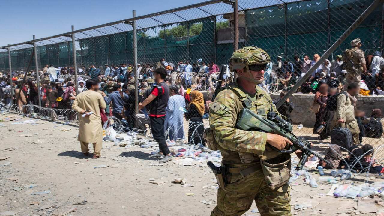 A supplied image shows Major Tim Glover, part of the 1st Battalion, Royal Australian Regiment ready combat team at Hamid Karzai International Airport in Kabul.