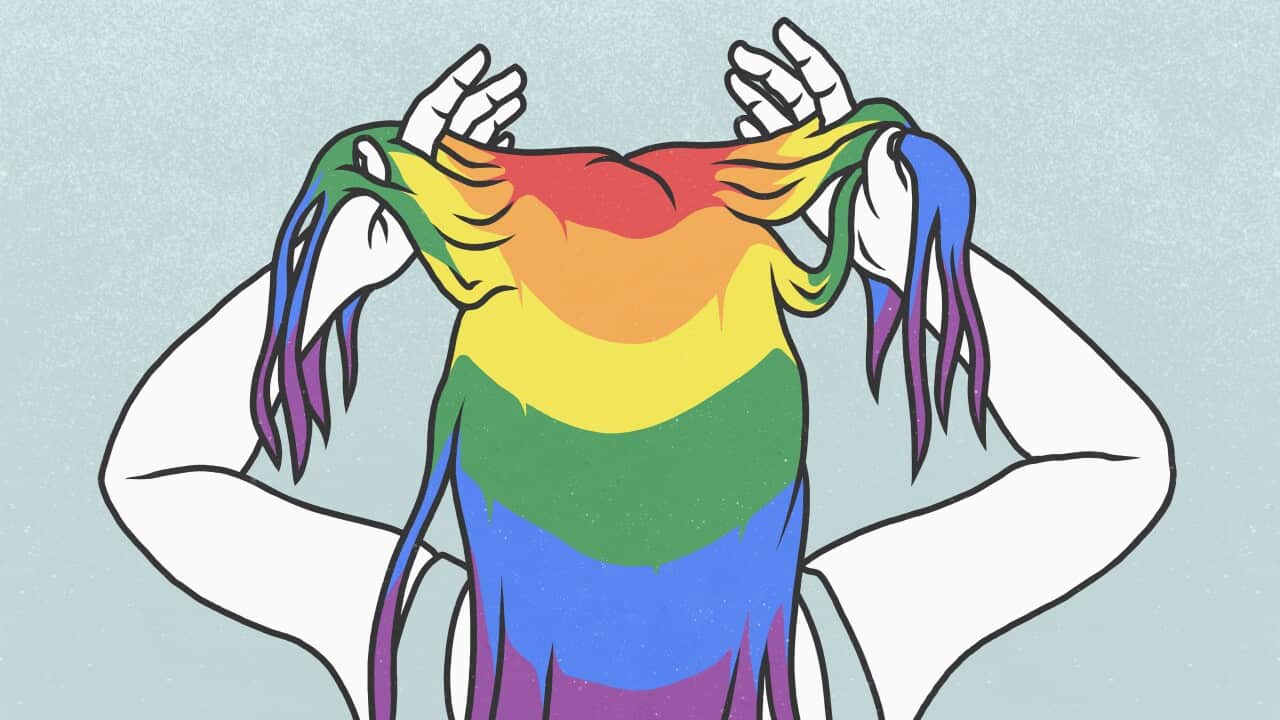 Woman with hands in rainbow hair