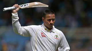 Australia's Usman Khawaja raises his bat