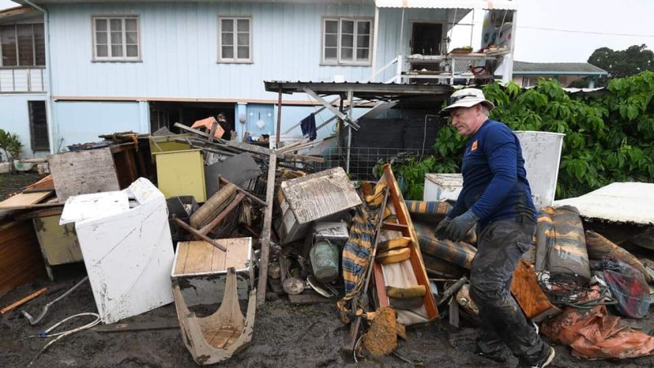 Residents struggling after Townsville's devastating flood have been hit with heatwave conditions.
