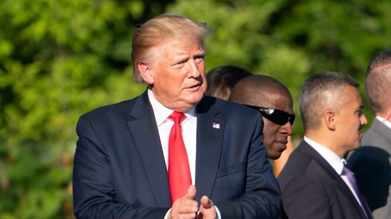 US President Donald J. Trump (L) greets guests attending the Congressional Picnic for Members of Congress 