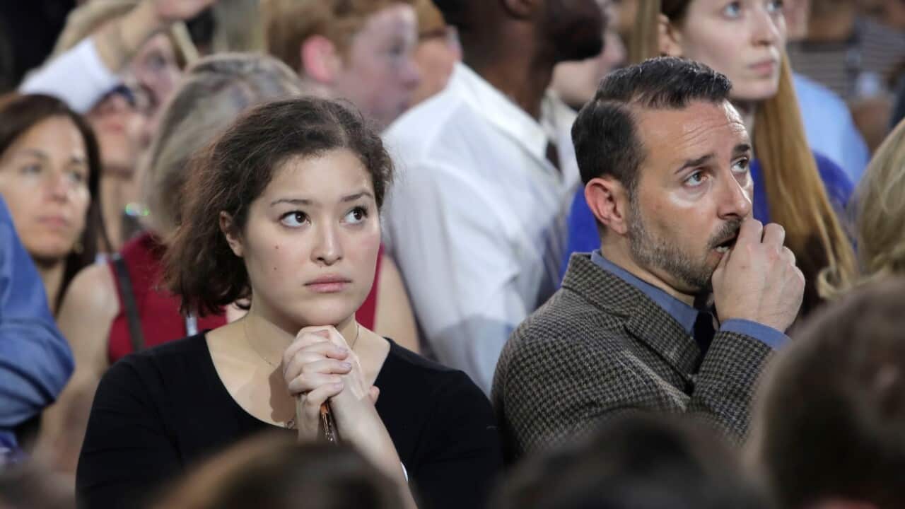 Guests watch returns during Democratic presidential nominee Hillary Clinton's election night rally in the Jacob Javits Center glass enclosed lobby in New York