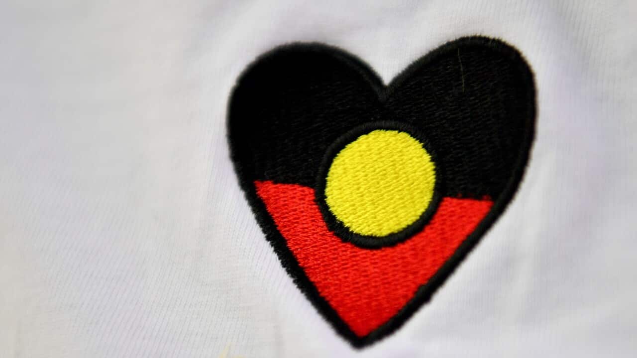 The colours of the Indigenous Flag represented as a heart