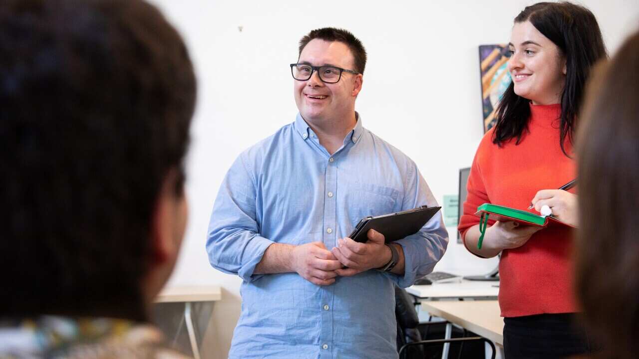 Man with down syndrome host a meeting