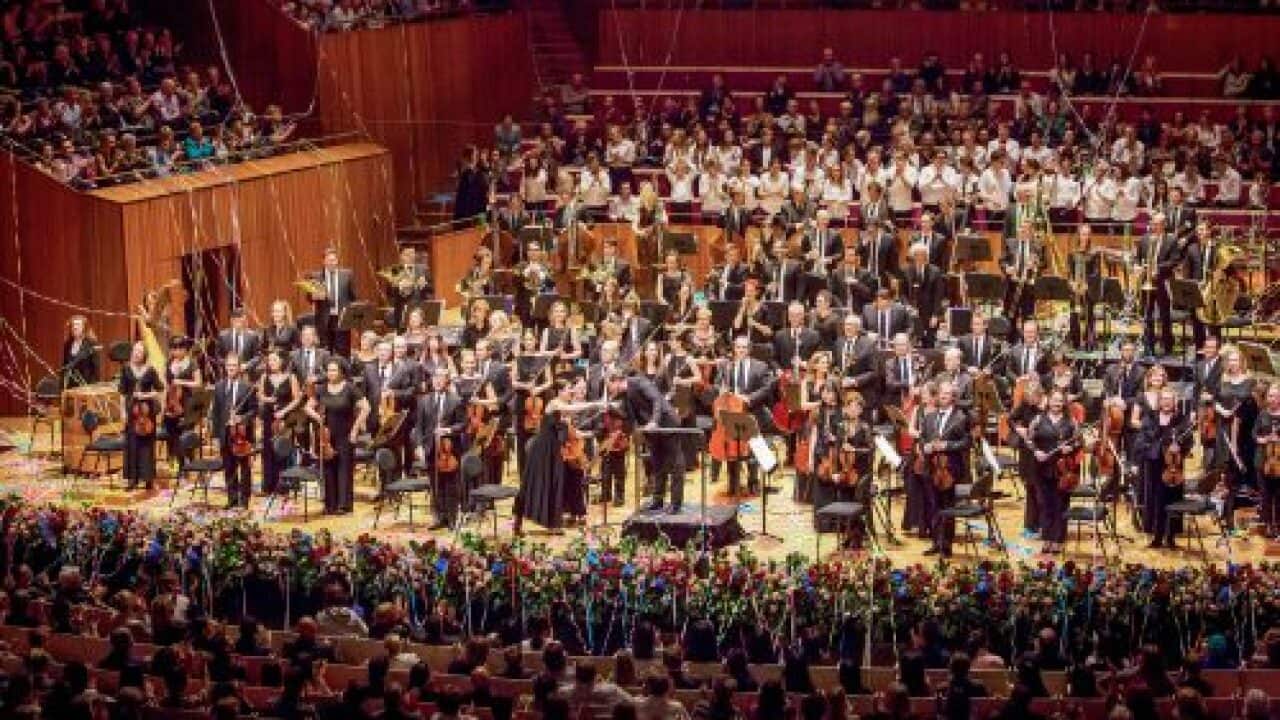 The Australian World Orchestra receives applause at a concert