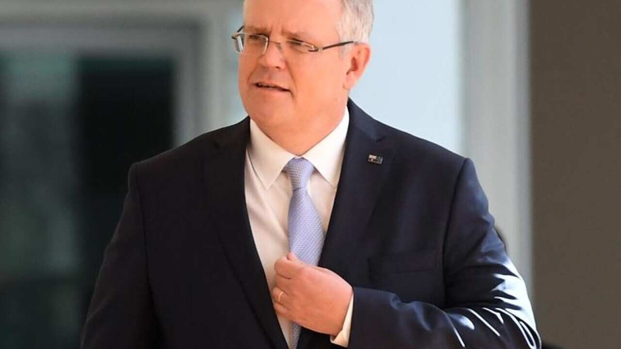 Treasurer Scott Morrison arrives for the Liberal Party room meeting.