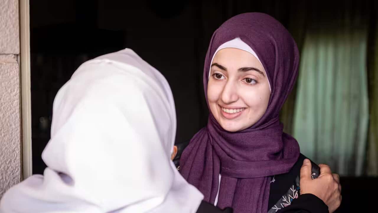 Two Muslim woman embracing.jpg