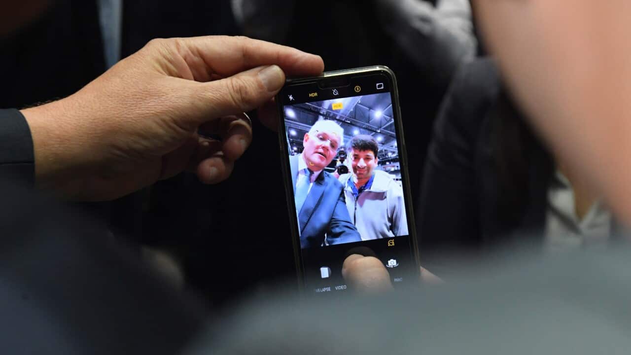 Prime Minister Scott Morrison takes a selfie at the Western Sydney Jobs Fair on Day 30 of the 2022 federal election campaign, at Olympic Park in Sydney, in the seat of Reid. Tuesday, May 10, 2022. (AAP Image/Mick Tsikas) NO ARCHIVING
