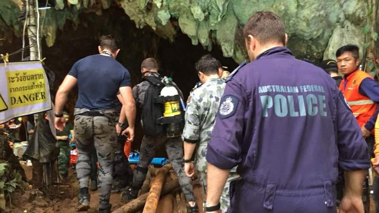 Rescue crews ready themselves to go back into the cave.