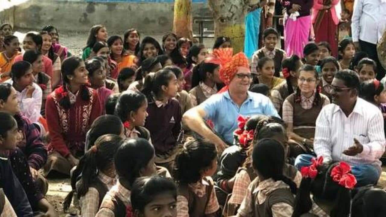 Mark Balla wih students