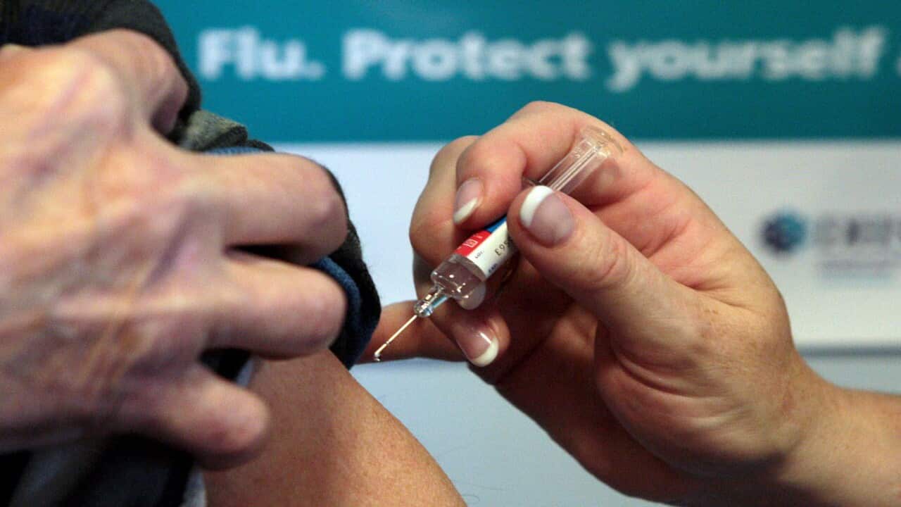 A person getting the flu vaccine.
