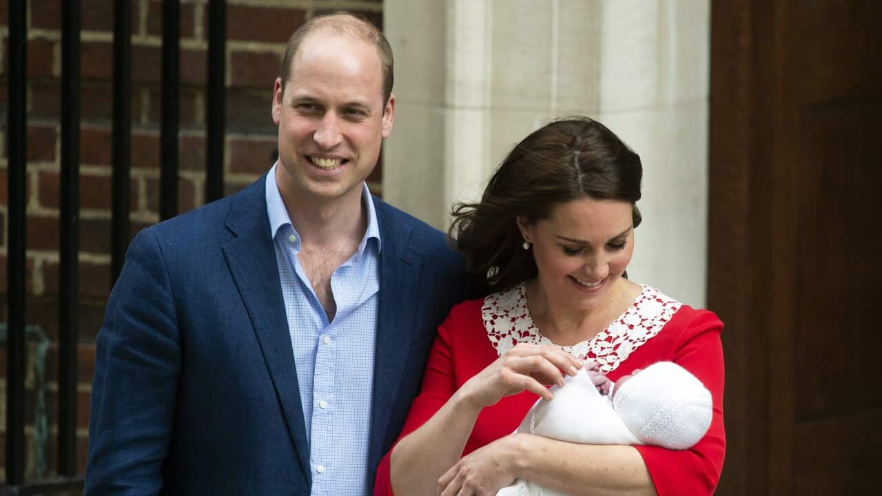 Britain's Prince William, Duke of Cambridge stands next to his wife Catherine Duchess of Cambridge who holds their newborn son.