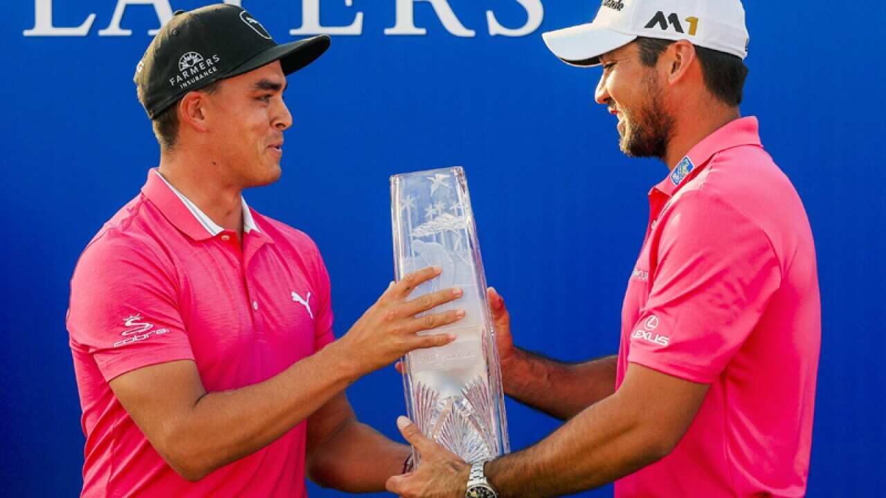 Australian golfer Jason Day (R) and American golfer Rickie Fowler (L)