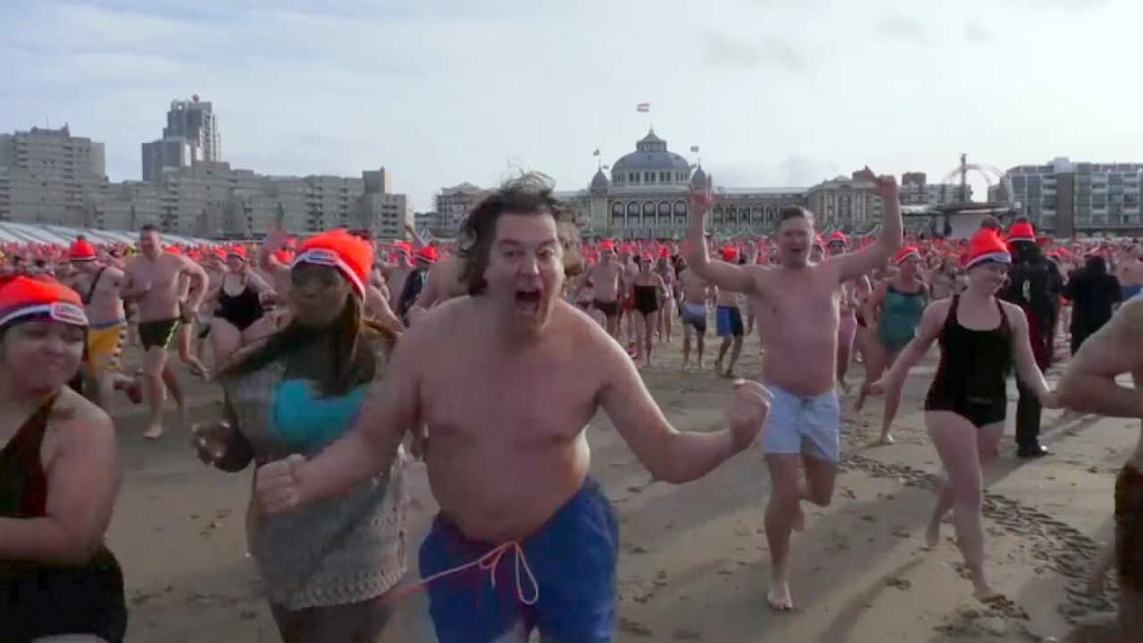 Dutch swimmers celebrate the New Year with an icy plunge into the North Sea. 