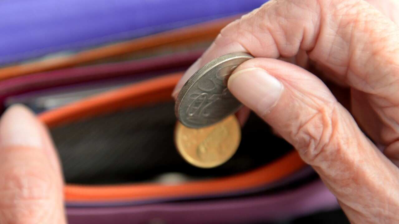 Money is taken out of a purse Canberra