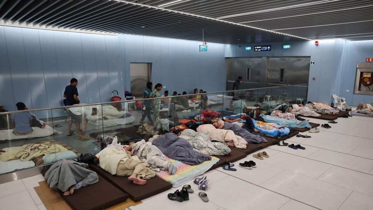People shelter at Tel Aviv Light Rail Station amid ongoing Iranian ballistic missile threat